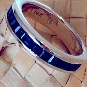 Sapphire eternity band in 14K solid gold. 1.25 carats of baguette cut sapphires.